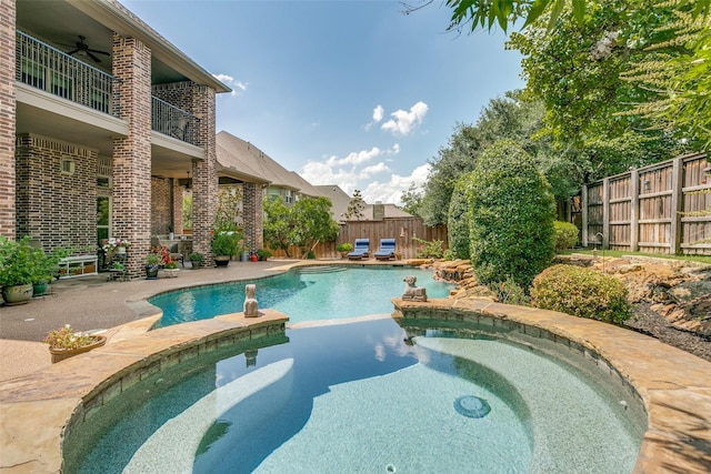 view of pool featuring ceiling fan