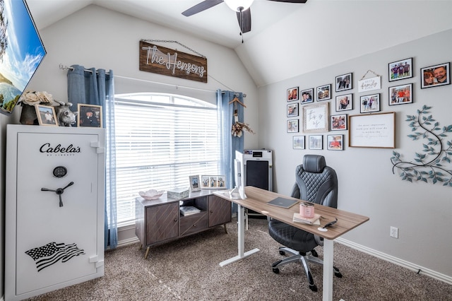 office area featuring carpet flooring, ceiling fan, and vaulted ceiling