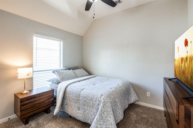 carpeted bedroom with ceiling fan and vaulted ceiling