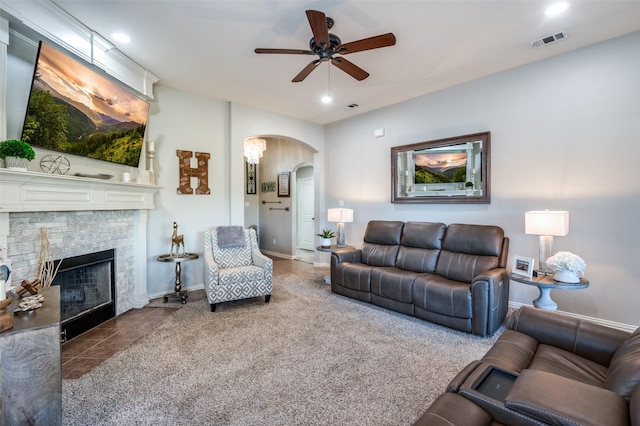 living room with carpet flooring, a fireplace, and ceiling fan