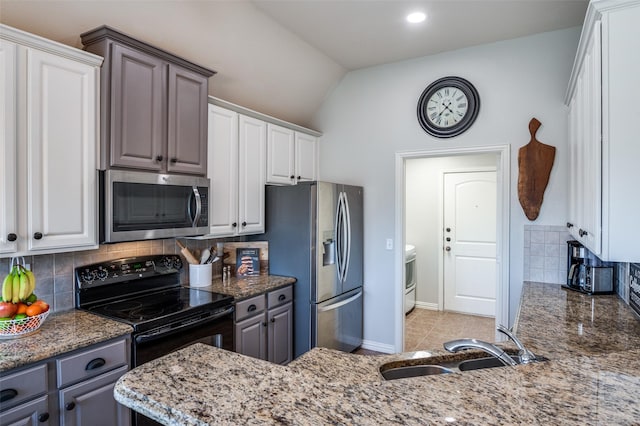 kitchen with sink, stainless steel appliances, gray cabinets, and white cabinetry