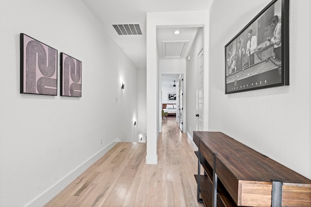 corridor featuring light hardwood / wood-style floors