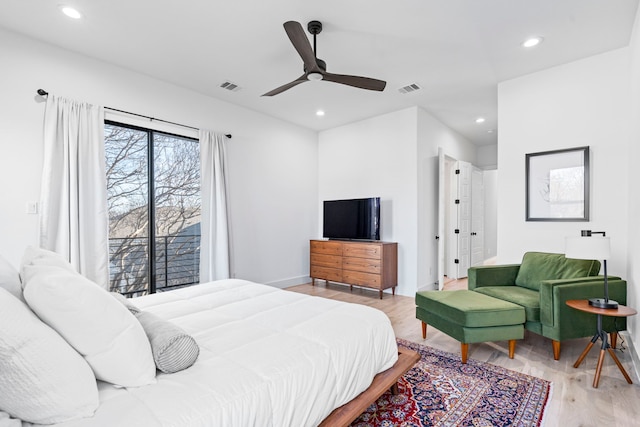 bedroom with light wood-type flooring and ceiling fan