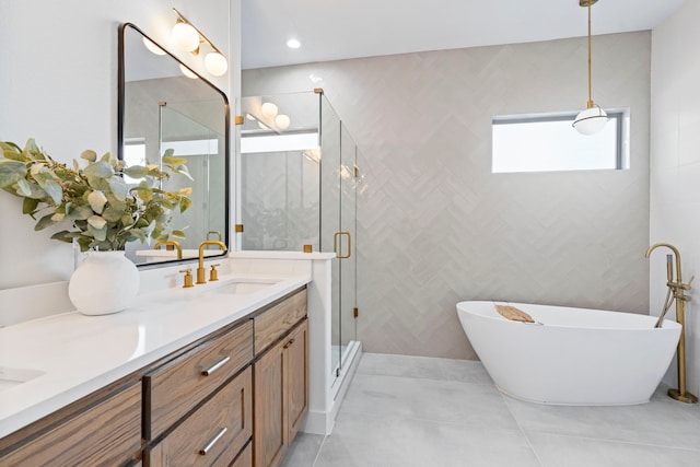 bathroom featuring independent shower and bath and vanity