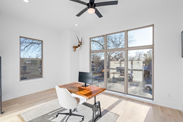 office area with ceiling fan and light wood-type flooring