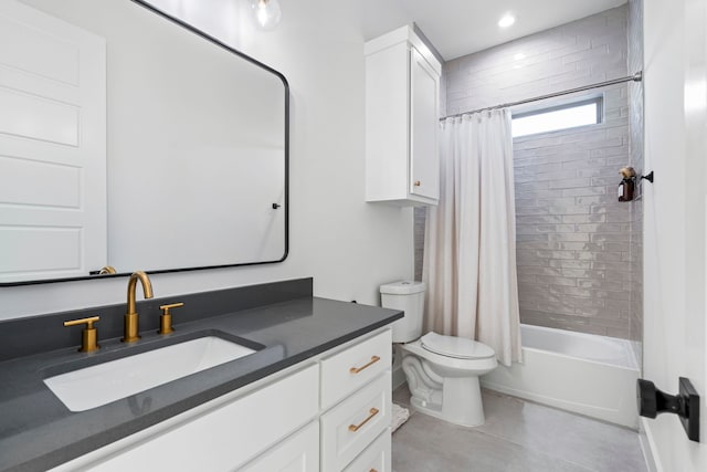 full bathroom with tile patterned flooring, shower / bath combination with curtain, vanity, and toilet