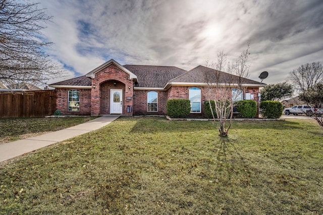 ranch-style house featuring a front lawn