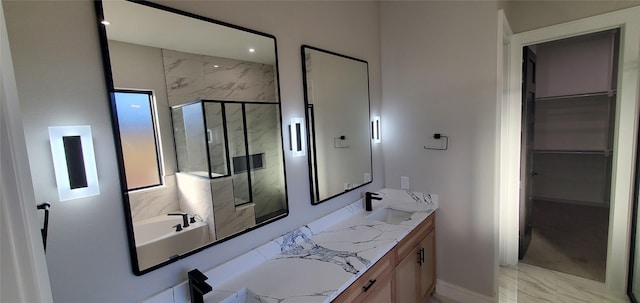 bathroom featuring shower with separate bathtub and vanity