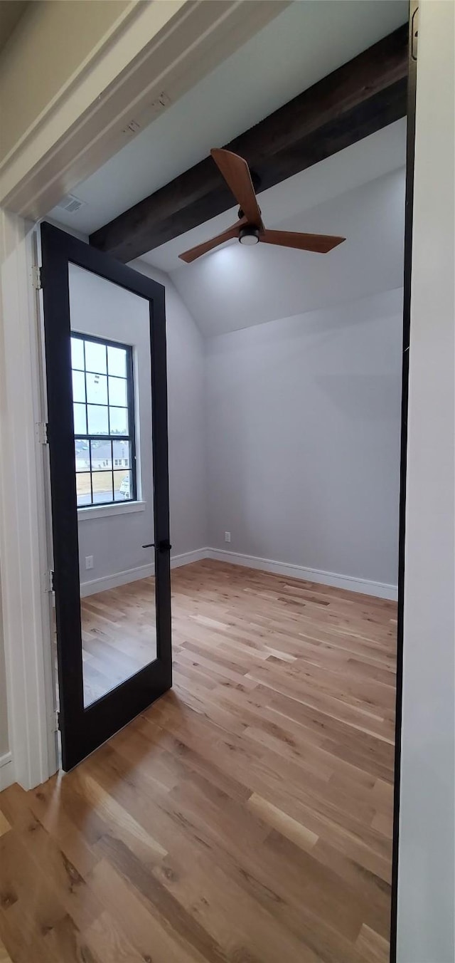 bonus room featuring ceiling fan, light hardwood / wood-style flooring, and lofted ceiling with beams