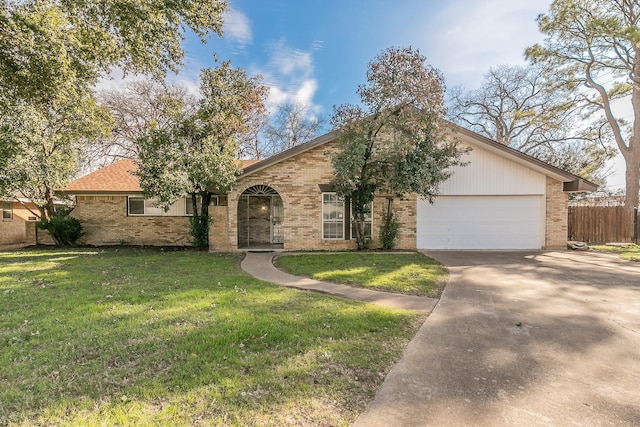 ranch-style home featuring a front yard and a garage