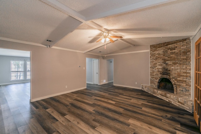 unfurnished living room featuring vaulted ceiling with beams, ceiling fan, dark hardwood / wood-style flooring, a brick fireplace, and a textured ceiling