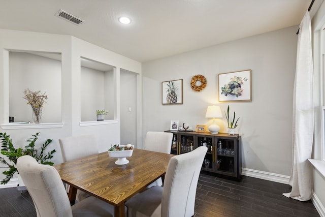 dining room featuring dark hardwood / wood-style flooring