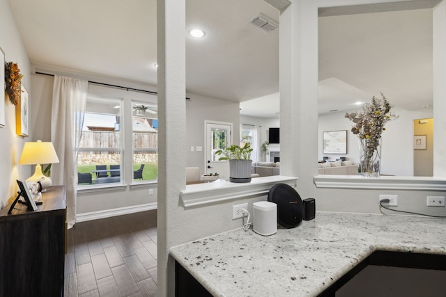 kitchen featuring light stone counters