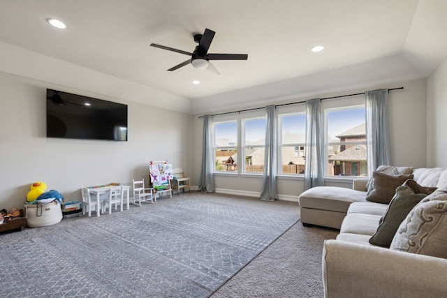 living room featuring carpet floors and ceiling fan