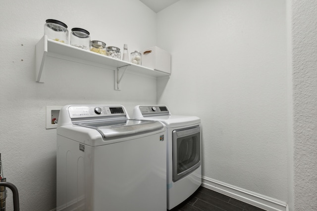 laundry room featuring dark wood-type flooring and washing machine and clothes dryer