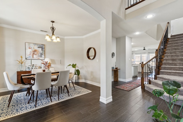 dining area with ceiling fan with notable chandelier and crown molding