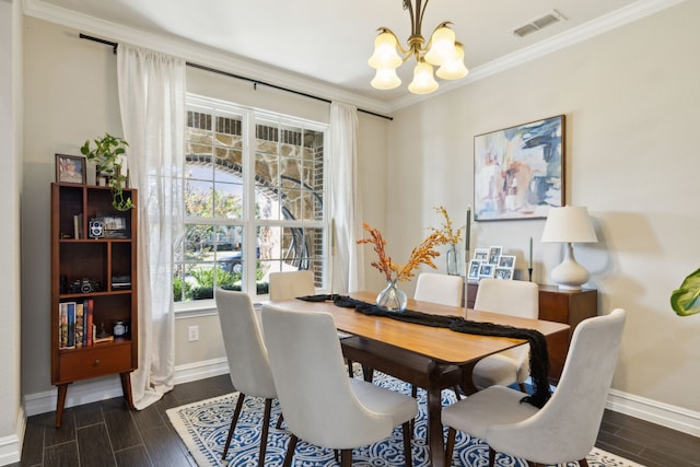 dining area featuring ornamental molding and a chandelier