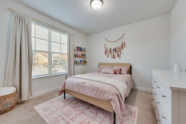 bedroom featuring light colored carpet