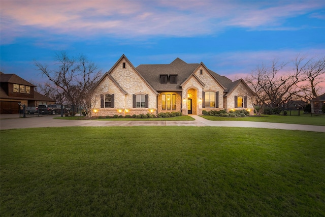 french country home with a yard