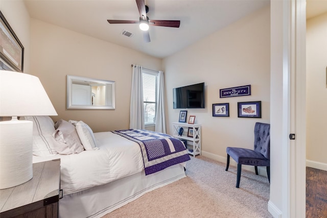 carpeted bedroom featuring ceiling fan and vaulted ceiling