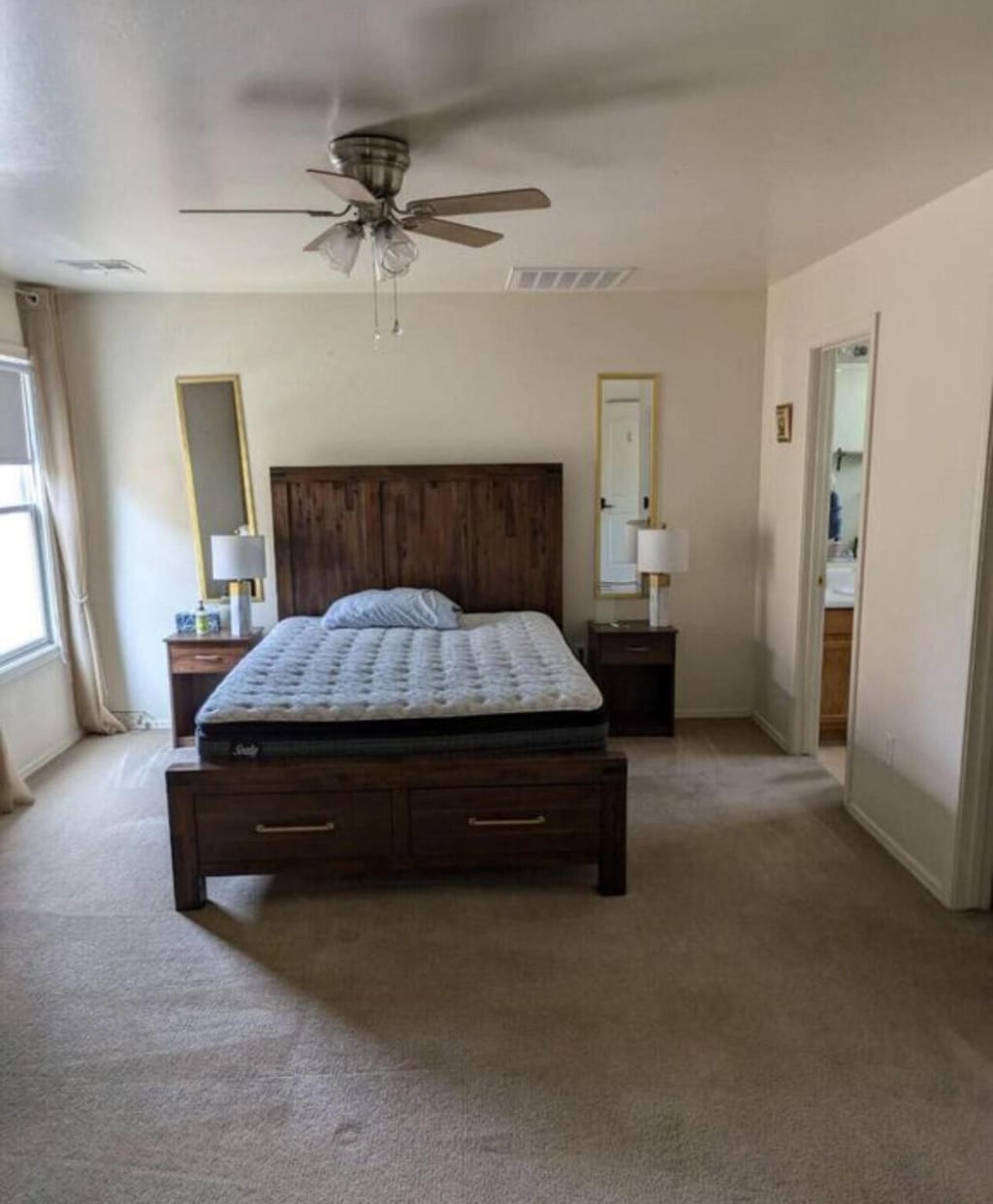 carpeted bedroom with ceiling fan