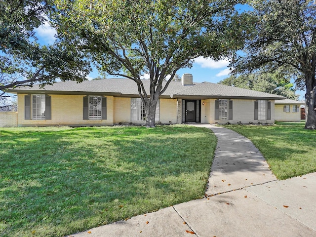 ranch-style house with a front lawn