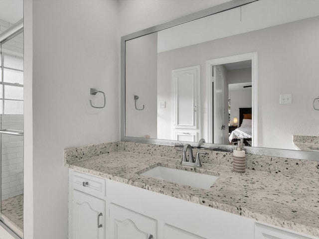 bathroom with vanity and walk in shower