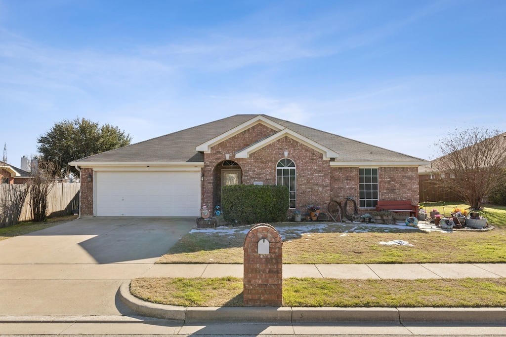 ranch-style house featuring a garage