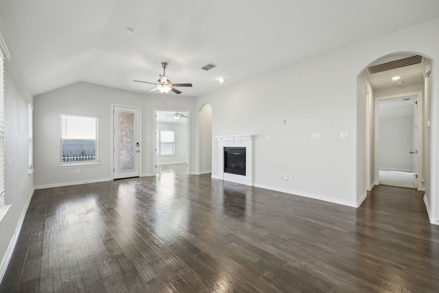 unfurnished living room featuring lofted ceiling, ceiling fan, and dark hardwood / wood-style floors