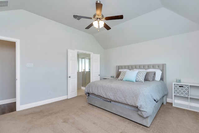 carpeted bedroom with ceiling fan and vaulted ceiling