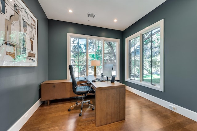 office space with hardwood / wood-style flooring and a wealth of natural light