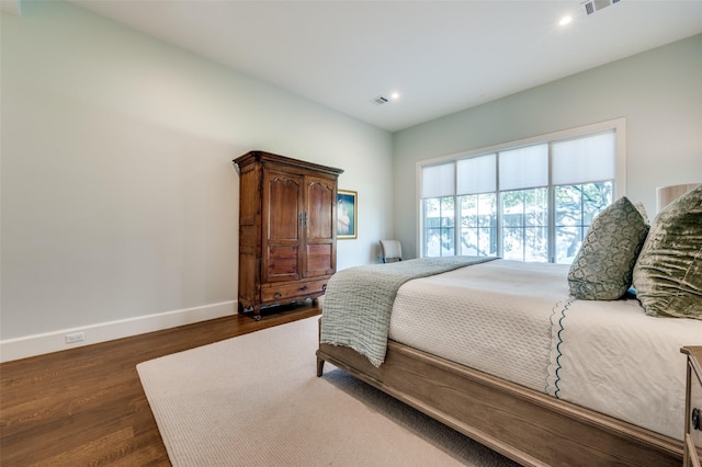 bedroom featuring dark hardwood / wood-style flooring