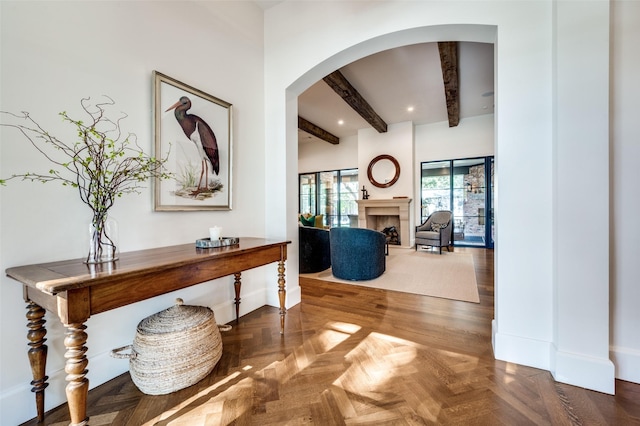 hall with beamed ceiling and parquet floors