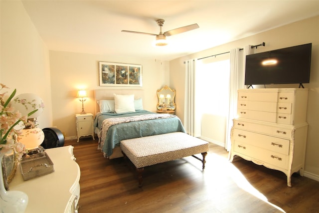 bedroom with ceiling fan and dark wood-type flooring