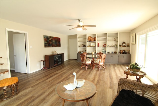 living room with ceiling fan and hardwood / wood-style floors