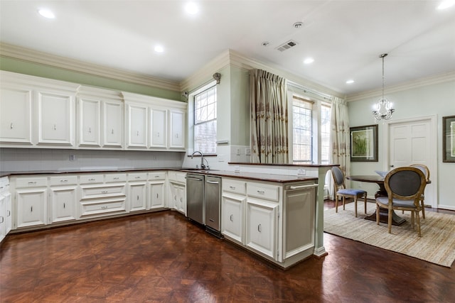 kitchen featuring decorative light fixtures, dark parquet flooring, and white cabinets