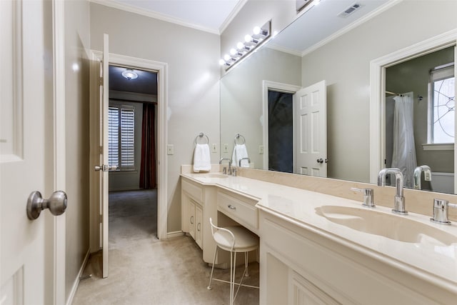 bathroom featuring ornamental molding and vanity