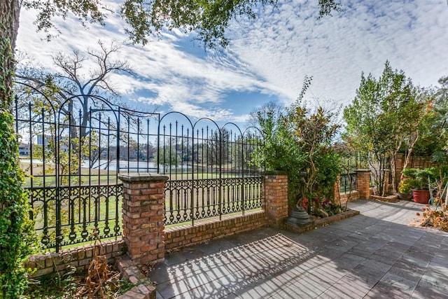 view of gate with a water view