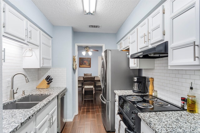 kitchen with ceiling fan, white cabinetry, black range with electric stovetop, and sink