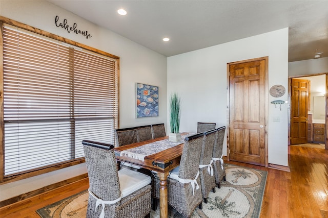 dining space with hardwood / wood-style floors