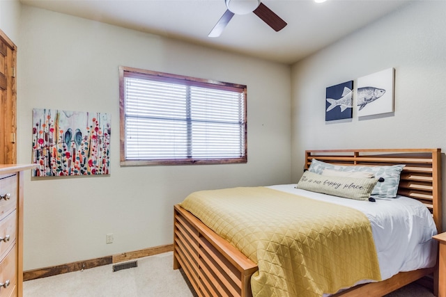 bedroom with ceiling fan and light colored carpet