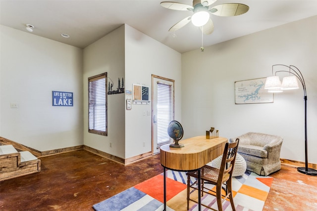 home office featuring concrete flooring and ceiling fan