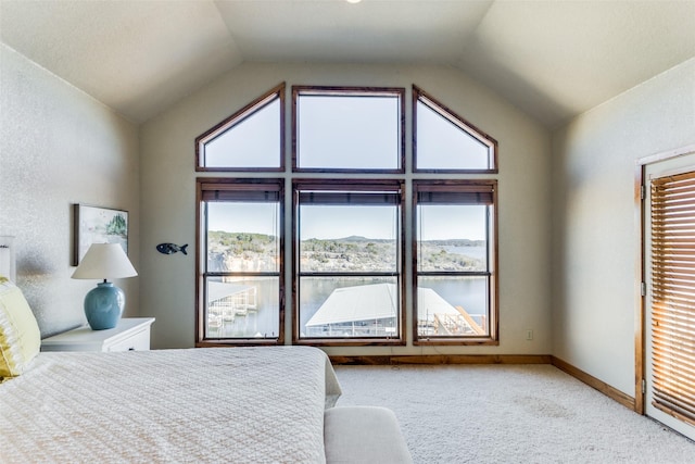 carpeted bedroom featuring lofted ceiling and a mountain view