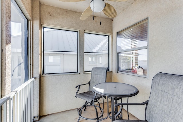 sunroom / solarium featuring ceiling fan