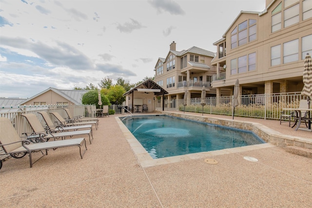 view of swimming pool with a patio and a gazebo