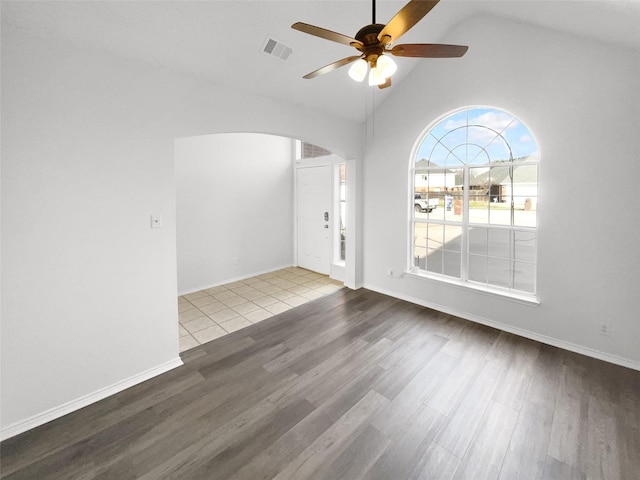 unfurnished room featuring ceiling fan, hardwood / wood-style floors, and vaulted ceiling