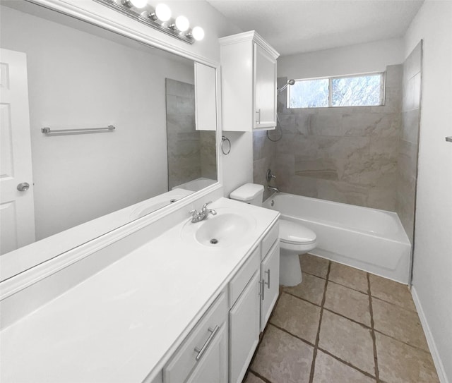 full bathroom featuring toilet, tile patterned flooring, tiled shower / bath, and vanity