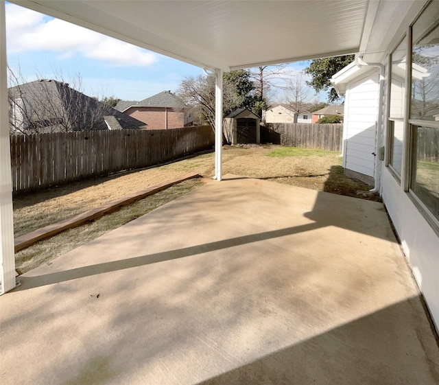 view of patio / terrace with a storage unit