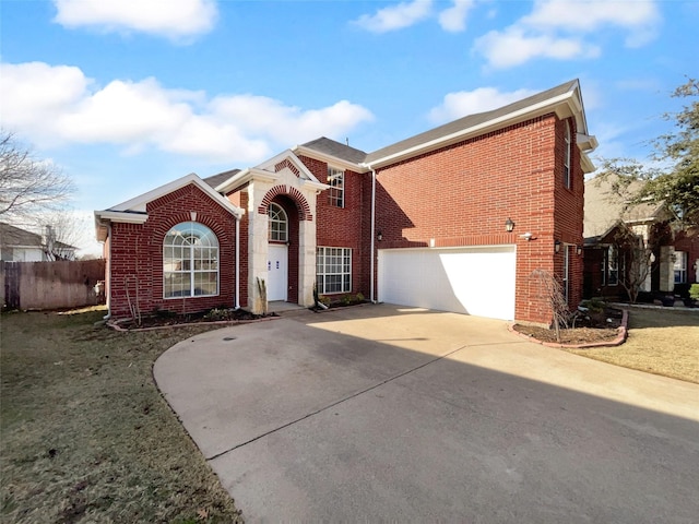 view of front property featuring a front yard and a garage