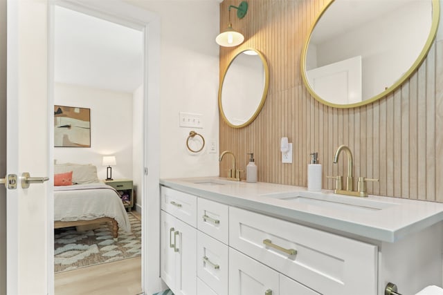 bathroom with hardwood / wood-style floors and vanity